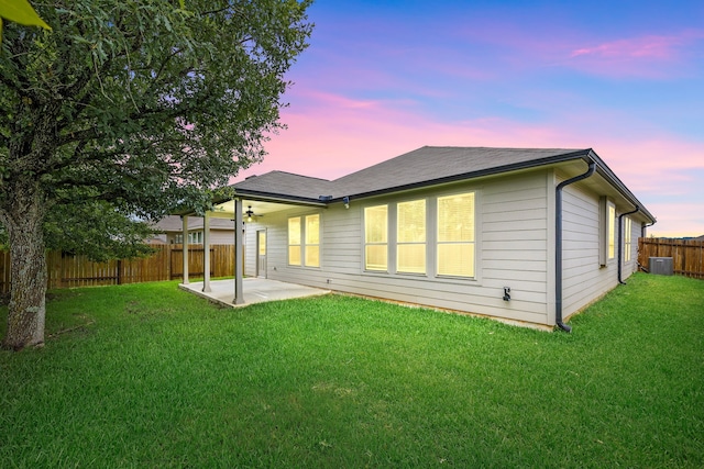 11323 Cora Ln, Willis, TX 77318 - back of property featuring a patio and a fenced backyard