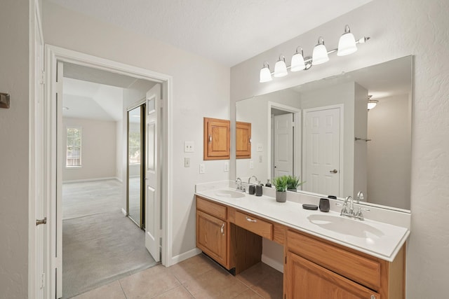 8602 Canyon Pine Dr, Spring, TX 77379 - bathroom featuring double vanity and tile patterned flooring