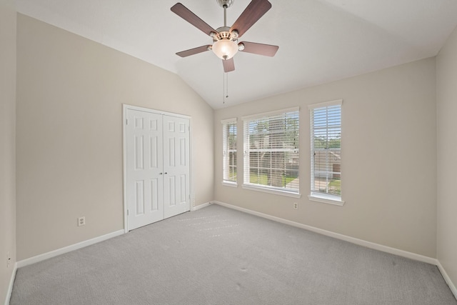 8602 Canyon Pine Dr, Spring, TX 77379 - unfurnished bedroom featuring carpet flooring, lofted ceiling, a closet, and ceiling fan