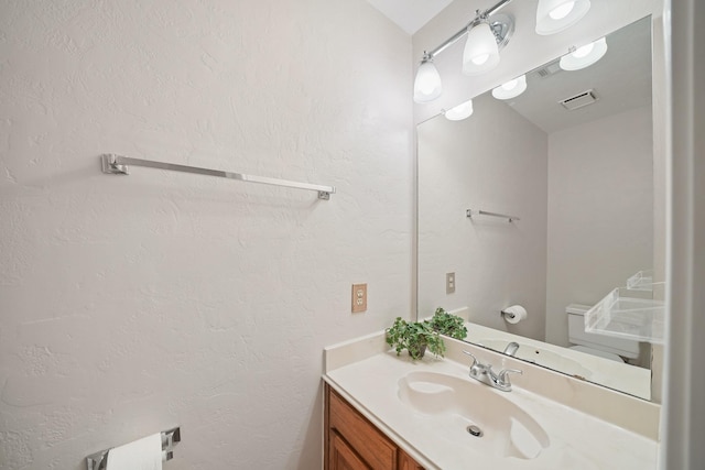 8602 Canyon Pine Dr, Spring, TX 77379 - half bathroom with vanity and a textured wall