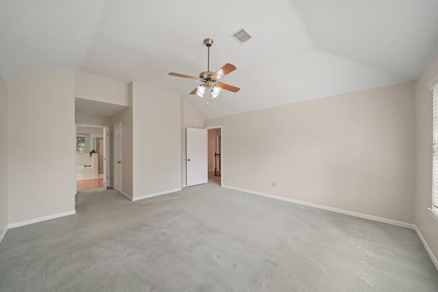 8602 Canyon Pine Dr, Spring, TX 77379 - unfurnished bedroom with vaulted ceiling, carpet, connected bathroom, and a ceiling fan