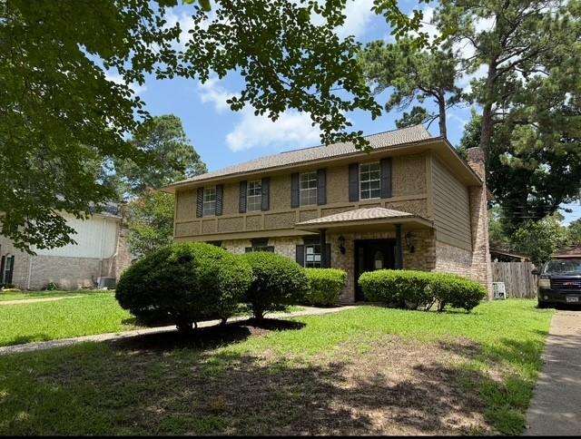 5914 Foresthaven Dr, Houston, TX 77066 - view of front of house featuring a chimney