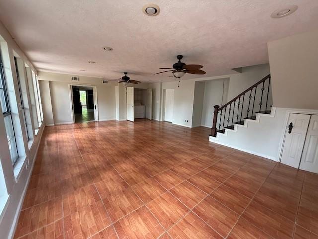 5914 Foresthaven Dr, Houston, TX 77066 - unfurnished living room with stairs, ceiling fan, and wood finished floors