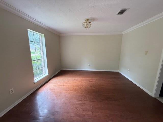 5914 Foresthaven Dr, Houston, TX 77066 - unfurnished room featuring crown molding and wood finished floors