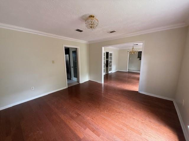 5914 Foresthaven Dr, Houston, TX 77066 - spare room with a chandelier, wood finished floors, and ornamental molding