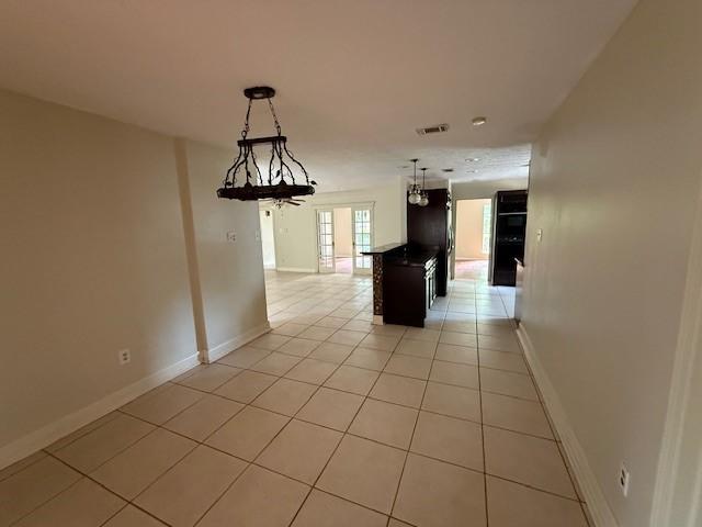 5914 Foresthaven Dr, Houston, TX 77066 - corridor with light tile patterned floors and baseboards