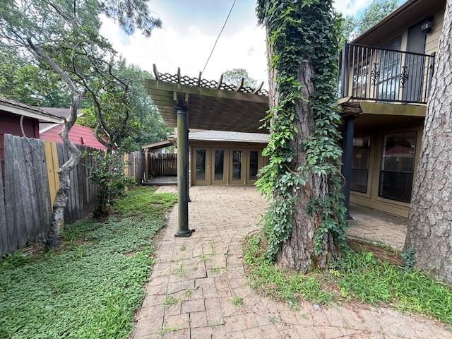 5914 Foresthaven Dr, Houston, TX 77066 - view of yard with a balcony and a patio