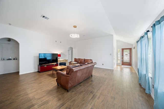 10919 Barker View Dr, Cypress, TX 77433 - living area with arched walkways, wood finished floors, and vaulted ceiling