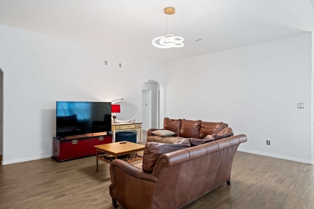 10919 Barker View Dr, Cypress, TX 77433 - living area featuring arched walkways, wood finished floors, and a chandelier