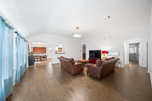 10919 Barker View Dr, Cypress, TX 77433 - living room featuring arched walkways, hardwood / wood-style flooring, and vaulted ceiling