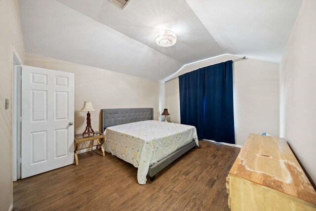 10919 Barker View Dr, Cypress, TX 77433 - bedroom featuring dark wood-style floors and vaulted ceiling