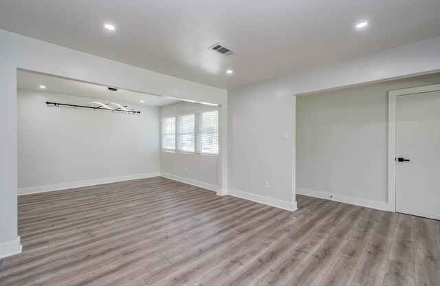 10415 Westray St, Houston, TX 77043 - spare room with wood finished floors and recessed lighting