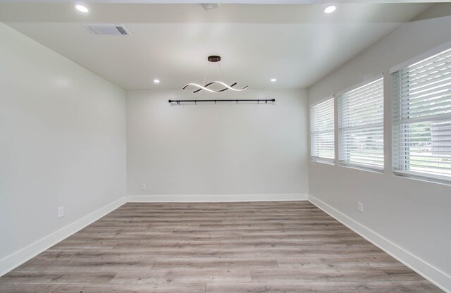 10415 Westray St, Houston, TX 77043 - empty room featuring a chandelier, recessed lighting, and light wood-style floors