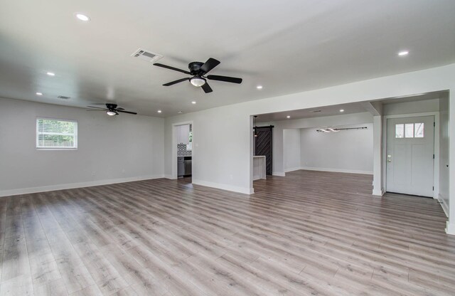 10415 Westray St, Houston, TX 77043 - unfurnished living room featuring recessed lighting, a ceiling fan, and light wood-style flooring