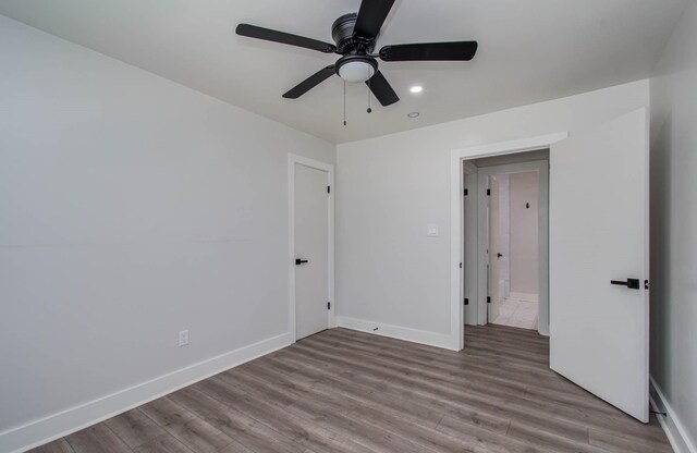 10415 Westray St, Houston, TX 77043 - unfurnished bedroom with wood finished floors, recessed lighting, and a ceiling fan