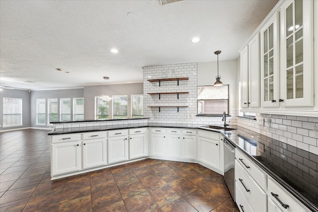 12823 Birch Falls Rd, Houston, TX 77065 - kitchen with dark countertops, a peninsula, a textured ceiling, recessed lighting, and tasteful backsplash