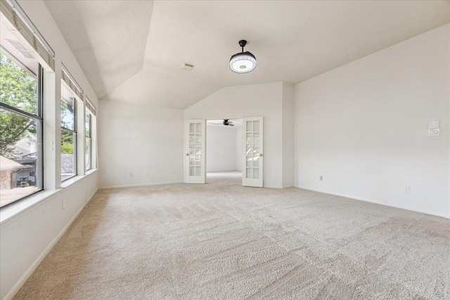 12823 Birch Falls Rd, Houston, TX 77065 - empty room featuring french doors, vaulted ceiling, light colored carpet, and a ceiling fan