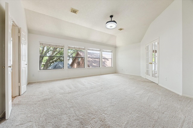 12823 Birch Falls Rd, Houston, TX 77065 - carpeted empty room with vaulted ceiling and french doors