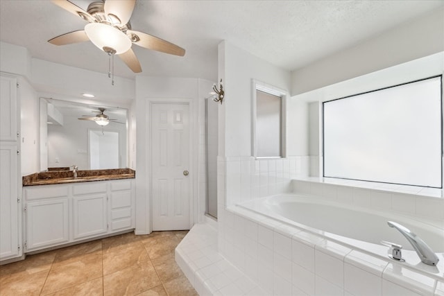 12823 Birch Falls Rd, Houston, TX 77065 - bathroom with a bath, vanity, a ceiling fan, an enclosed shower, and tile patterned flooring