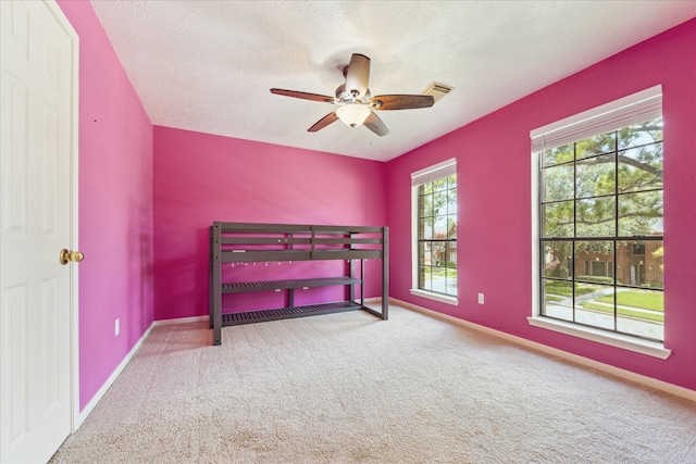 12823 Birch Falls Rd, Houston, TX 77065 - carpeted bedroom featuring baseboards and ceiling fan