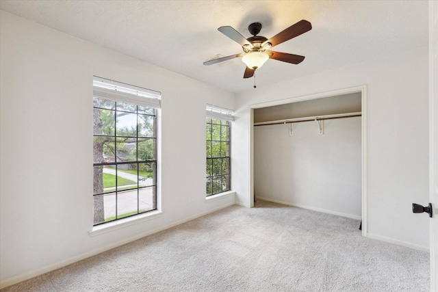 12823 Birch Falls Rd, Houston, TX 77065 - unfurnished bedroom with carpet, a closet, and ceiling fan