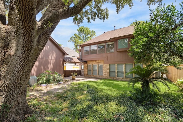 12823 Birch Falls Rd, Houston, TX 77065 - back of house with a patio area, brick siding, and roof with shingles