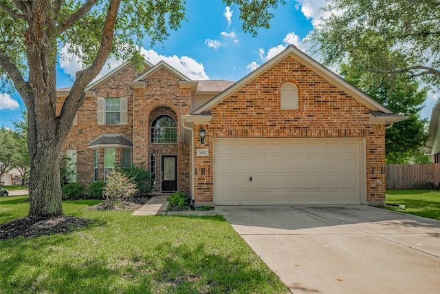 5403 Round Hollow Ct, Katy, TX 77494 - traditional-style house with driveway, a garage, and brick siding