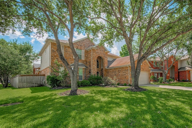 5403 Round Hollow Ct, Katy, TX 77494 - traditional-style house with concrete driveway, a front lawn, brick siding, and an attached garage