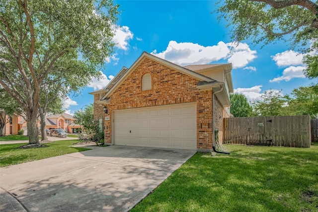 5403 Round Hollow Ct, Katy, TX 77494 - view of side of home with brick siding, concrete driveway, and an attached garage