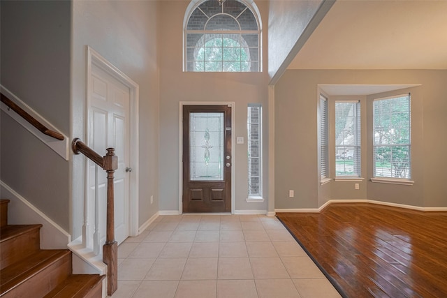 5403 Round Hollow Ct, Katy, TX 77494 - entrance foyer with healthy amount of natural light, stairs, light tile patterned flooring, and a high ceiling