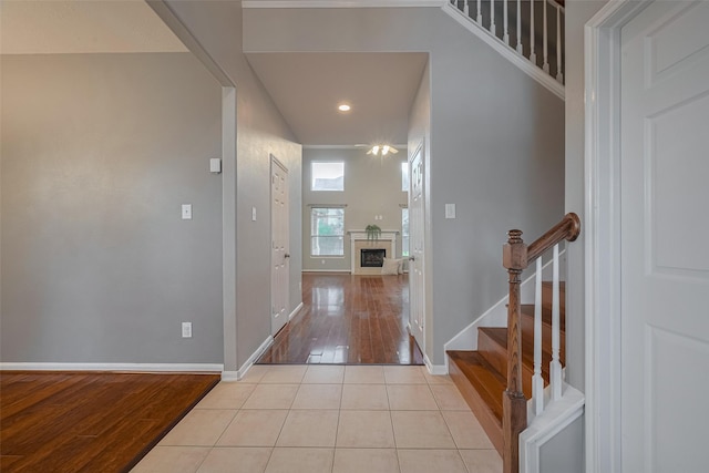 5403 Round Hollow Ct, Katy, TX 77494 - foyer with light wood-style flooring, a fireplace, stairs, and recessed lighting