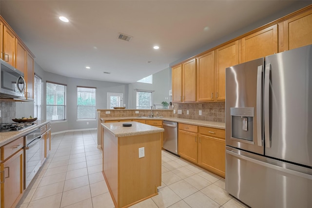 5403 Round Hollow Ct, Katy, TX 77494 - kitchen featuring stainless steel appliances, light tile patterned flooring, decorative backsplash, recessed lighting, and a peninsula
