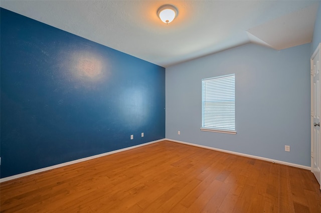 5403 Round Hollow Ct, Katy, TX 77494 - unfurnished room with wood finished floors and vaulted ceiling