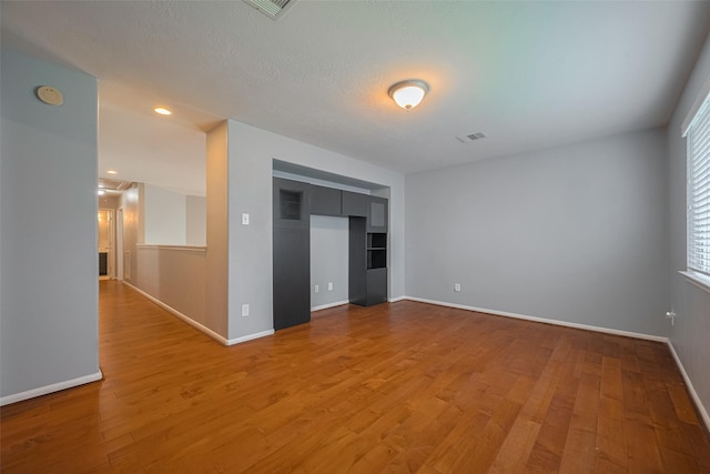 5403 Round Hollow Ct, Katy, TX 77494 - spare room with a smoke detector, light wood-type flooring, and recessed lighting