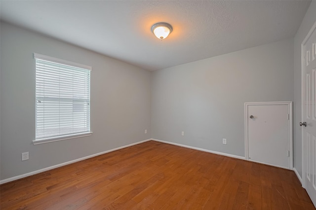 5403 Round Hollow Ct, Katy, TX 77494 - empty room featuring wood finished floors and baseboards