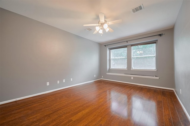 5403 Round Hollow Ct, Katy, TX 77494 - empty room featuring dark wood-style floors and a ceiling fan