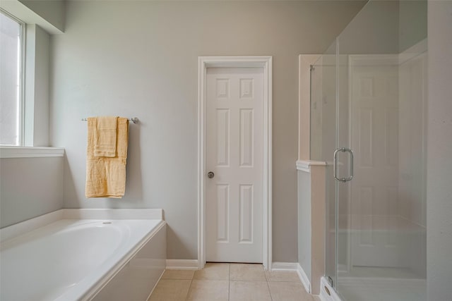 5403 Round Hollow Ct, Katy, TX 77494 - bathroom with a stall shower, tile patterned floors, and a garden tub