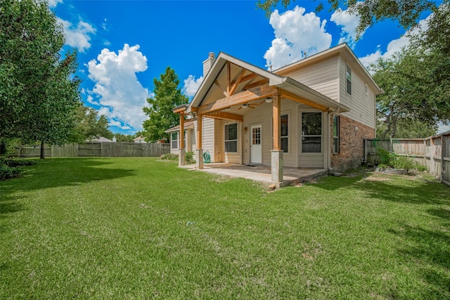5403 Round Hollow Ct, Katy, TX 77494 - back of house with a ceiling fan, a chimney, a patio, and a fenced backyard
