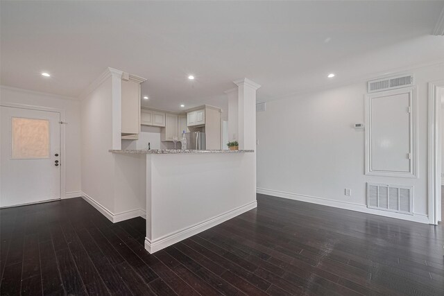 2333 Bering Dr Unit 334, Houston, TX 77057 - kitchen featuring freestanding refrigerator, dark wood-type flooring, light stone counters, ornamental molding, and recessed lighting