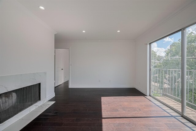 2333 Bering Dr Unit 334, Houston, TX 77057 - unfurnished living room with ornamental molding, hardwood / wood-style floors, a premium fireplace, and recessed lighting