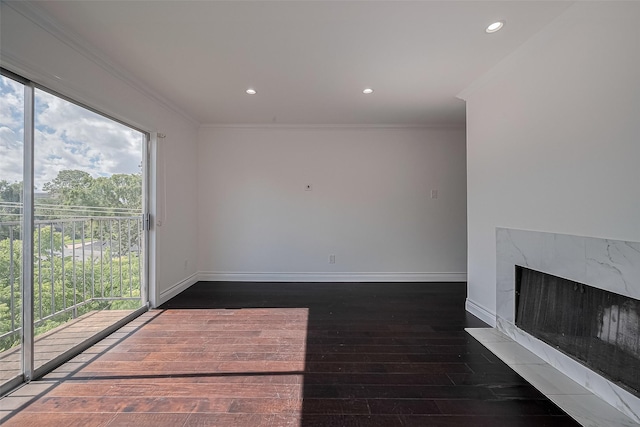 2333 Bering Dr Unit 334, Houston, TX 77057 - unfurnished living room with crown molding, hardwood / wood-style floors, recessed lighting, and a high end fireplace