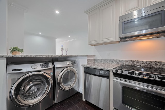2333 Bering Dr Unit 334, Houston, TX 77057 - laundry area with washer and clothes dryer and dark wood-type flooring