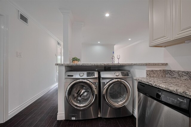 2333 Bering Dr Unit 334, Houston, TX 77057 - laundry room featuring washing machine and dryer, dark wood-style floors, crown molding, and recessed lighting