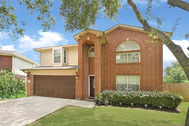 129 Breezy Shore Ct, Dickinson, TX 77539 - traditional-style home with brick siding, concrete driveway, and a garage