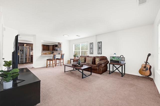 129 Breezy Shore Ct, Dickinson, TX 77539 - living area featuring light colored carpet and baseboards