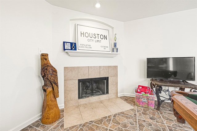 129 Breezy Shore Ct, Dickinson, TX 77539 - living room with baseboards and a tiled fireplace