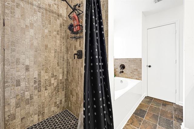 129 Breezy Shore Ct, Dickinson, TX 77539 - full bathroom with stone tile floors, a bath, and tiled shower