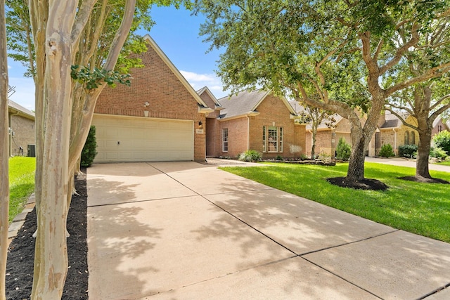 4946 Westchester Dr, Fulshear, TX 77441 - view of front of house featuring brick siding, driveway, a front lawn, and a garage