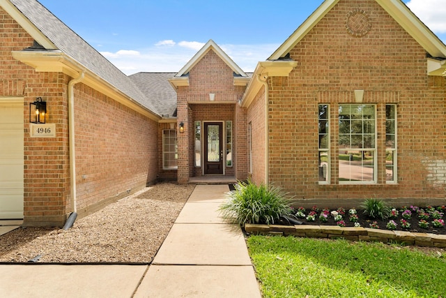 4946 Westchester Dr, Fulshear, TX 77441 - property entrance featuring brick siding, a shingled roof, and an attached garage
