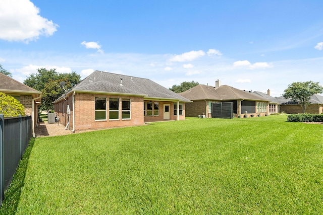4946 Westchester Dr, Fulshear, TX 77441 - rear view of house with brick siding